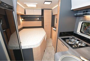 The Hobby Optima De Luxe T70 F low-profile motorhome bedroom