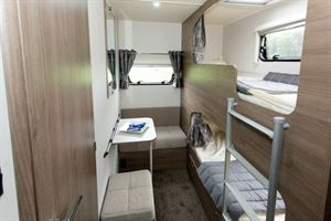 Two bunks in secluded pods and a little seating area