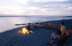 canoeists by a campfire