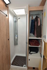 Separate shower has the wardrobe alongside